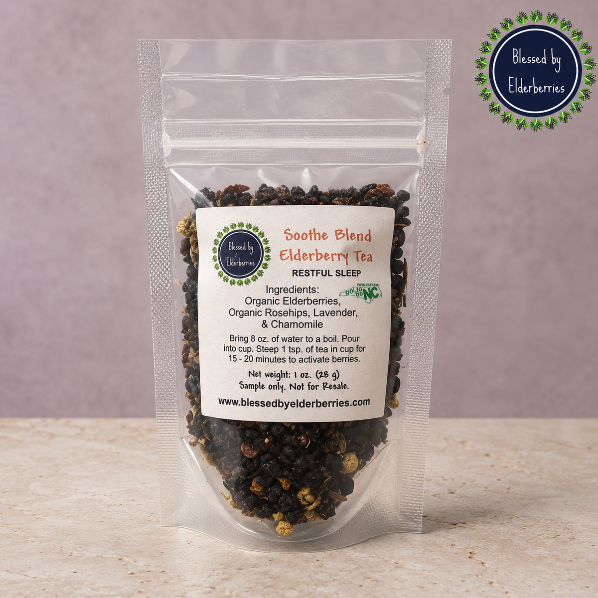 Clear 1 oz sample pouch of Soothe Blend Elderberry Tea with visible loose herbal tea