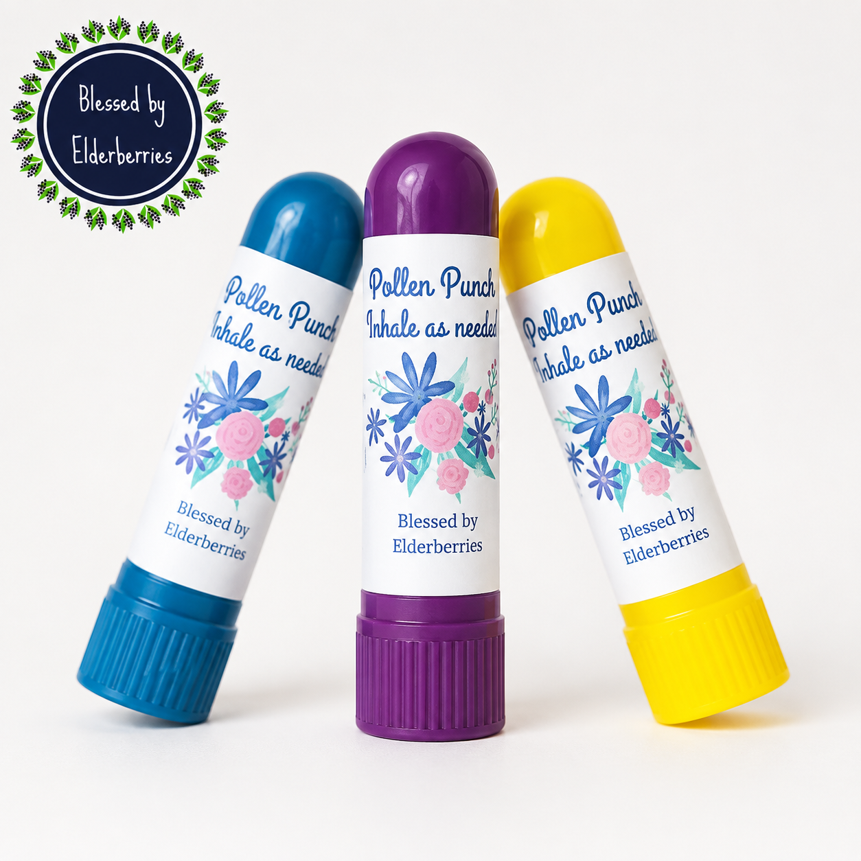 Three colorful Pollen Punch essential oil inhalers with lemon, lavender, and peppermint by Blessed by Elderberries.