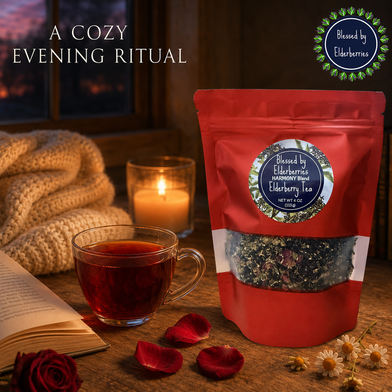 Harmony Blend Elderberry Tea beside a warm glass cup, candle, open book, cream blanket, chamomile, and deep red rose petals.