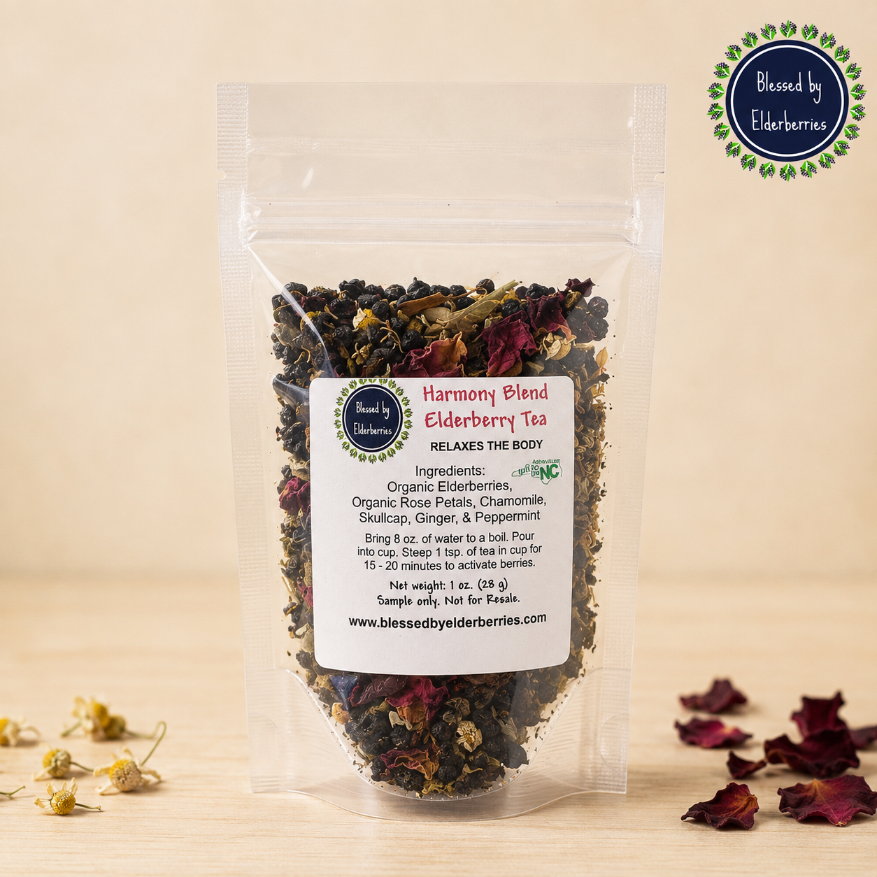 Clear 1 oz bag of Harmony Blend Elderberry Tea with visible organic elderberries, herbs, and red rose petals.