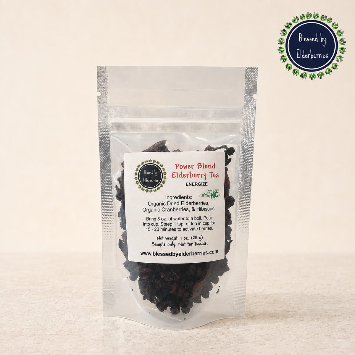 Clear 1 oz sample pouch of Power Blend Elderberry Herbal Tea with visible loose-leaf tea and Blessed by Elderberries logo