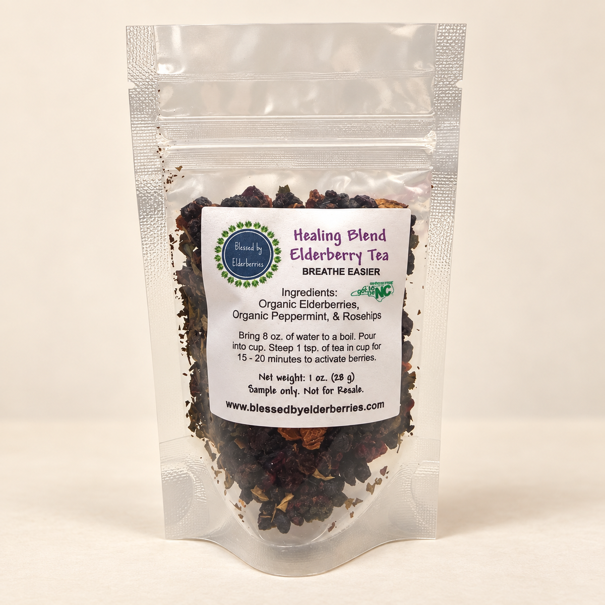 Clear 1 oz sample pouch of Healing Blend Elderberry Herbal Tea with the loose herbal blend visible.